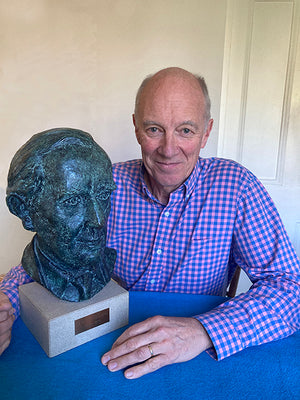 Merlin Unwin with a bronze bust of J.R.R.Tolkien